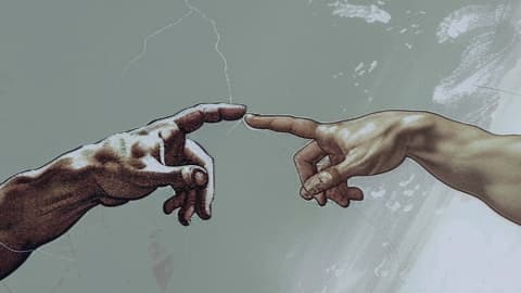 Close-up of hands directing a film scene